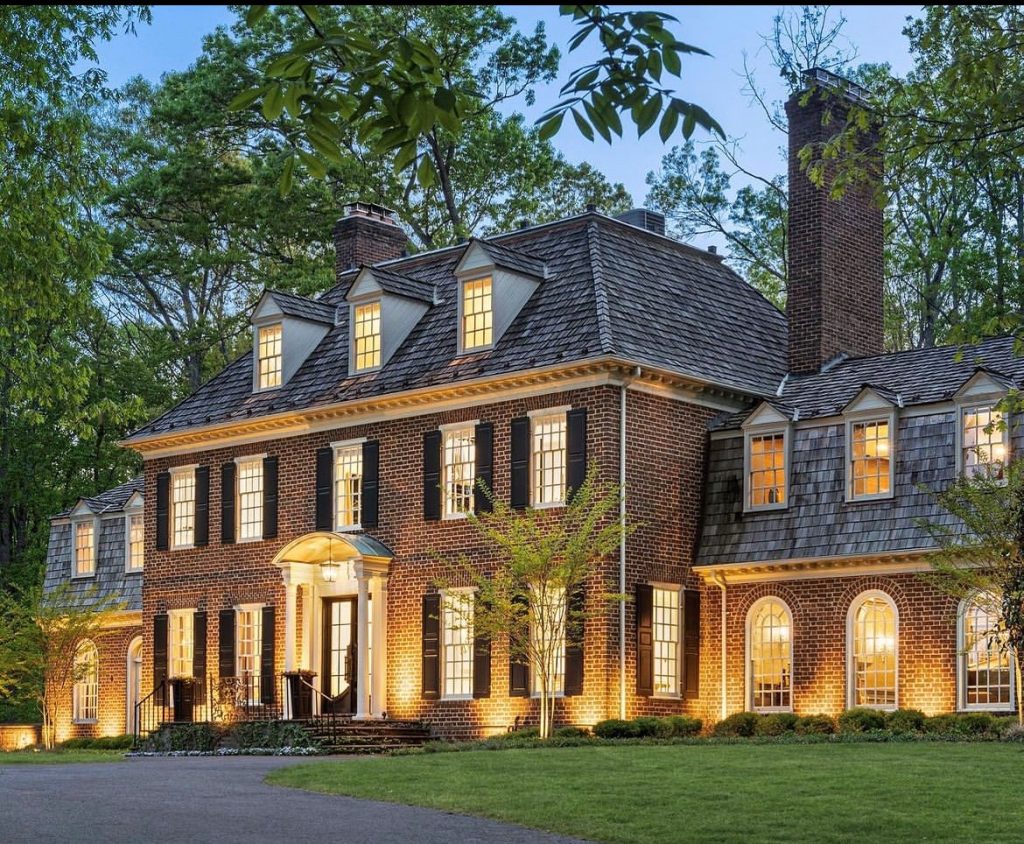 beautiful mansion with stunning outdoor lighting system